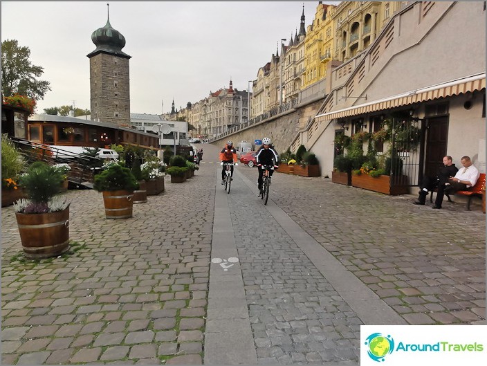 Cycle paths run along the embankment of the Vltava River in Prague