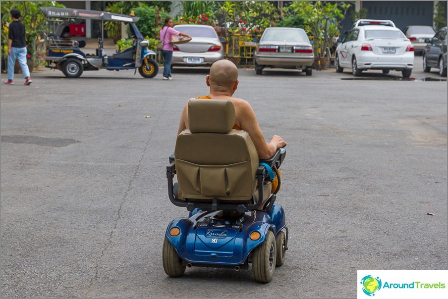 Monk in a wheelchair