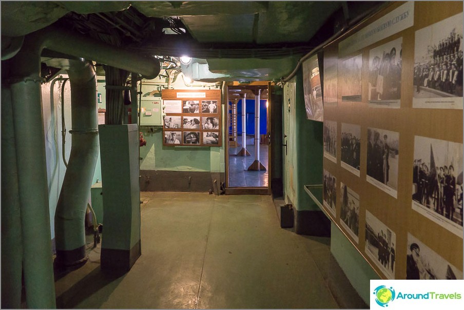 Stands with photographs in front of the entrance to the wardroom