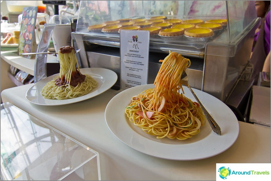 Funny showcase with flying pasta in a cafe